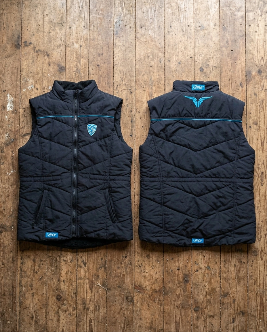 Black quilted vest with brand logo on a wooden surface